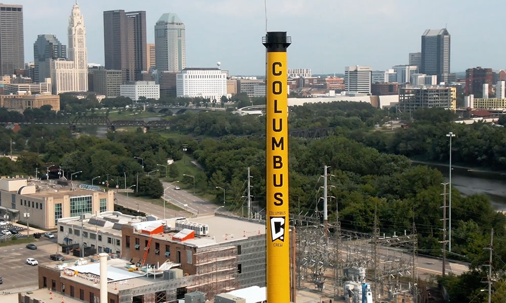 Columbus Crew large yellow tower with cityscape background